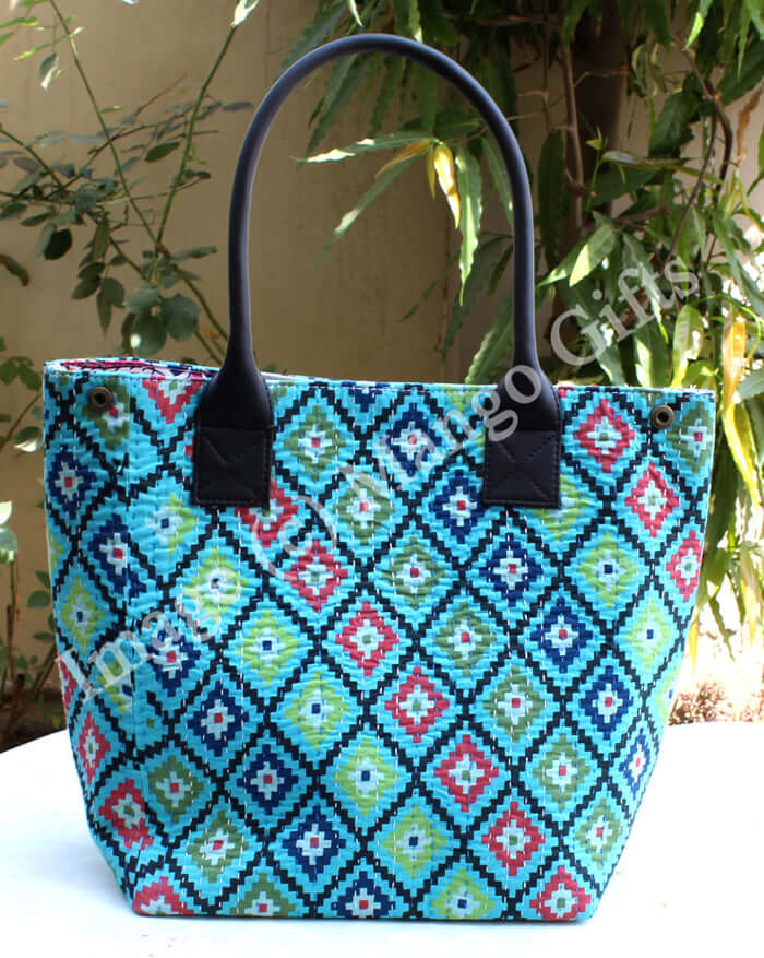Blue geometric cotton Kantha tote bag with leather straps, perfect for shopping or picnics.